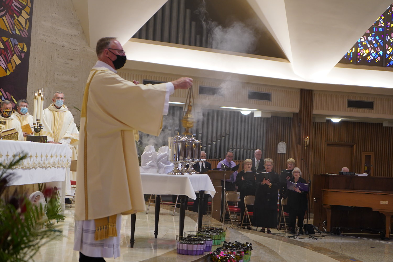 Deacon John Schwartze incenses the congregation during the Chrism Mass on March 30, 2021, in the Cathedral of St. Joseph in Jefferson City.